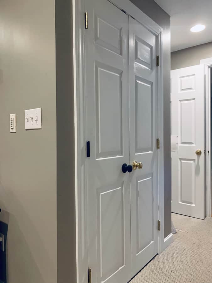 New updated door hardware next to old door hardware