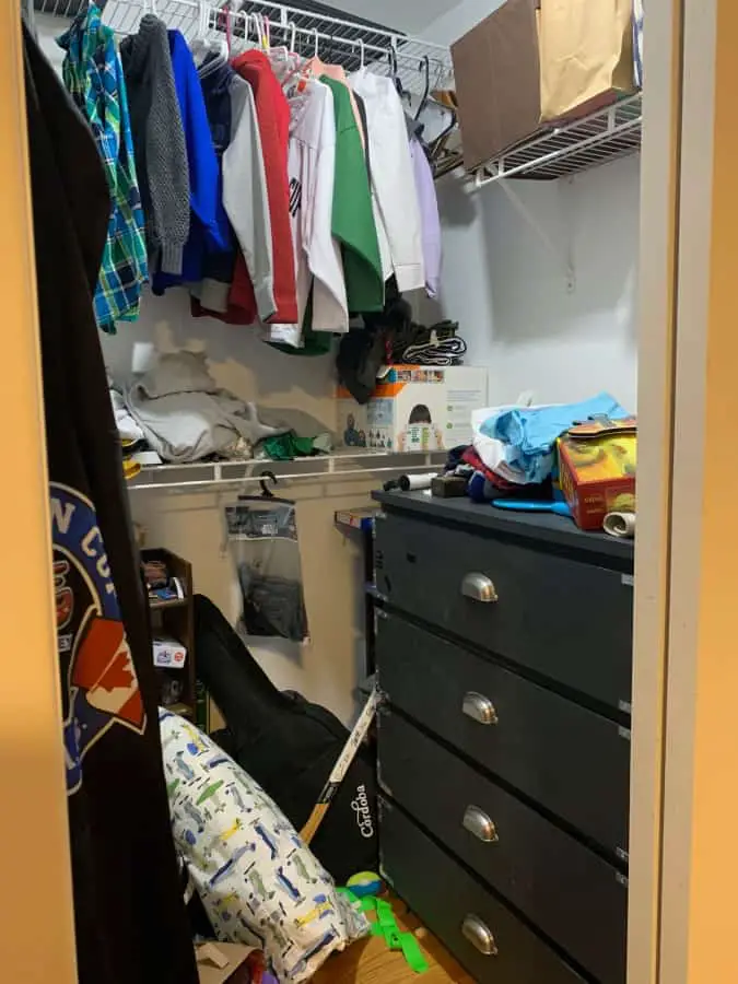 Before closet disorganized