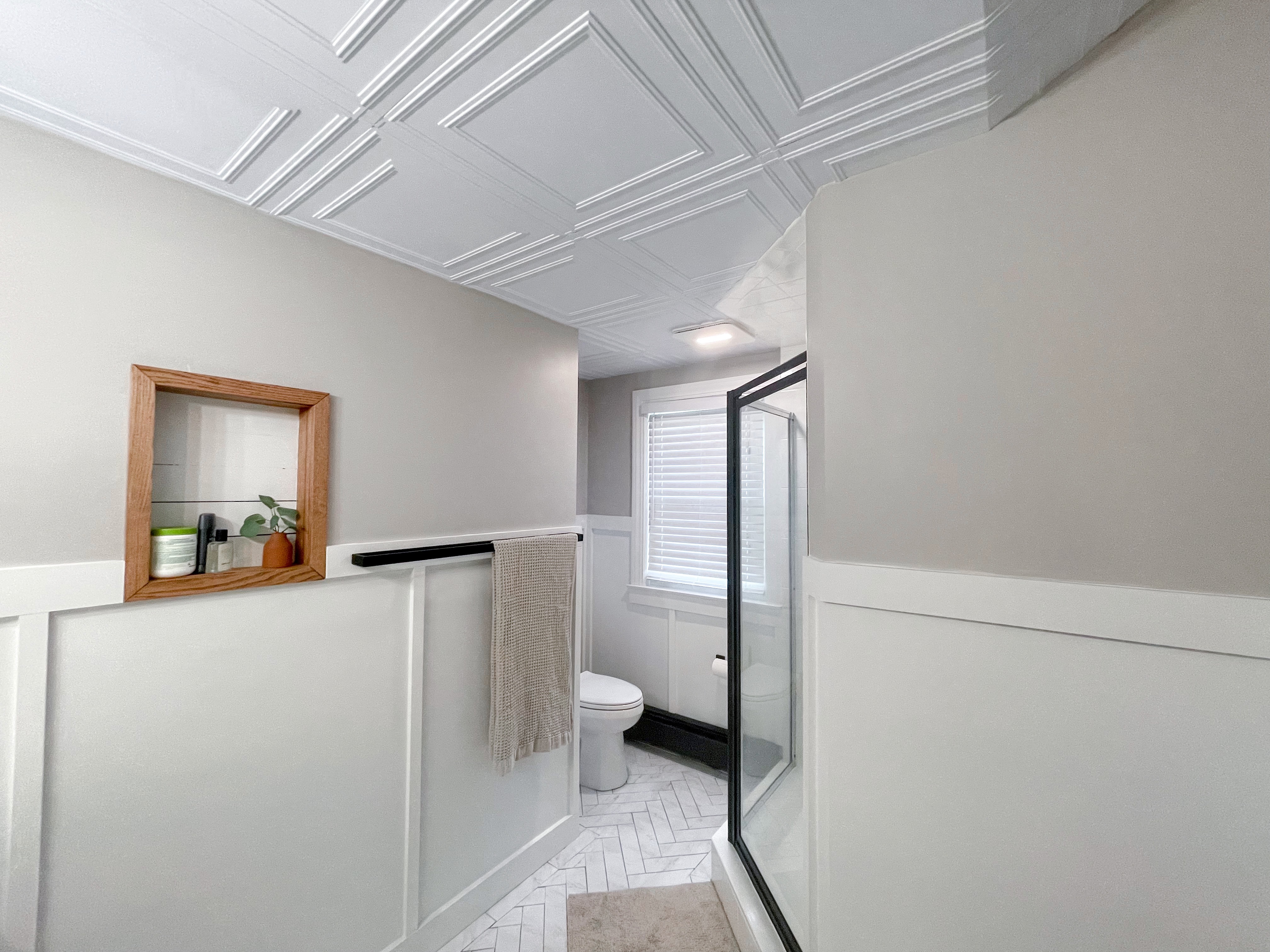 Full bathroom view with ceiling